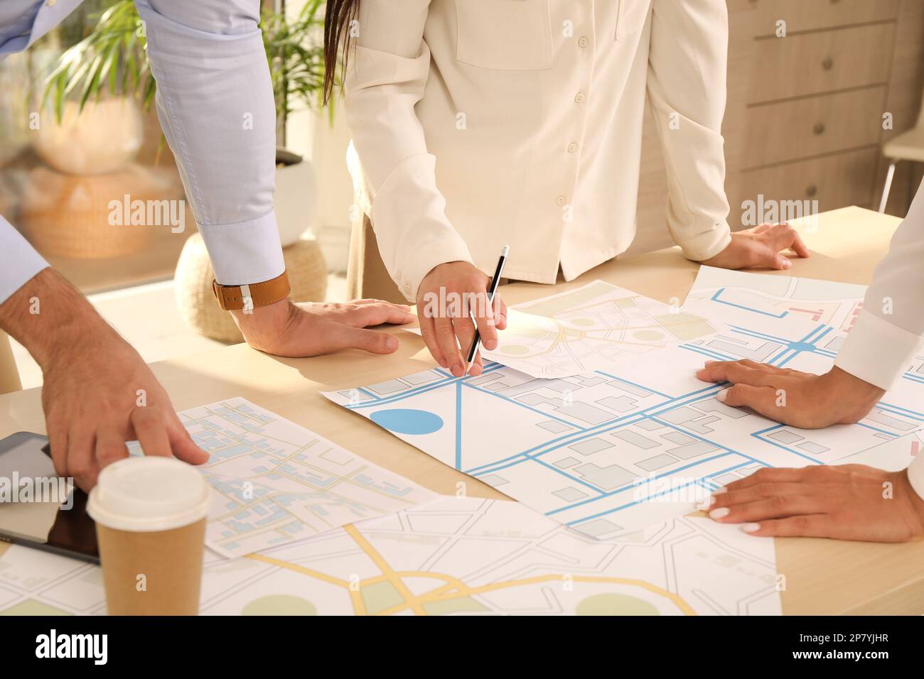 Professional Cartographers Working With Cadastral Map At Table In   Professional Cartographers Working With Cadastral Map At Table In Office Closeup 2P7YJHR 