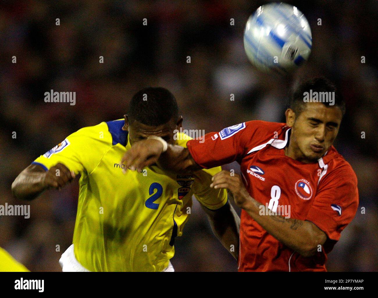 Ecuador's Guagua, left, fights for the ball with Chile's Arturo