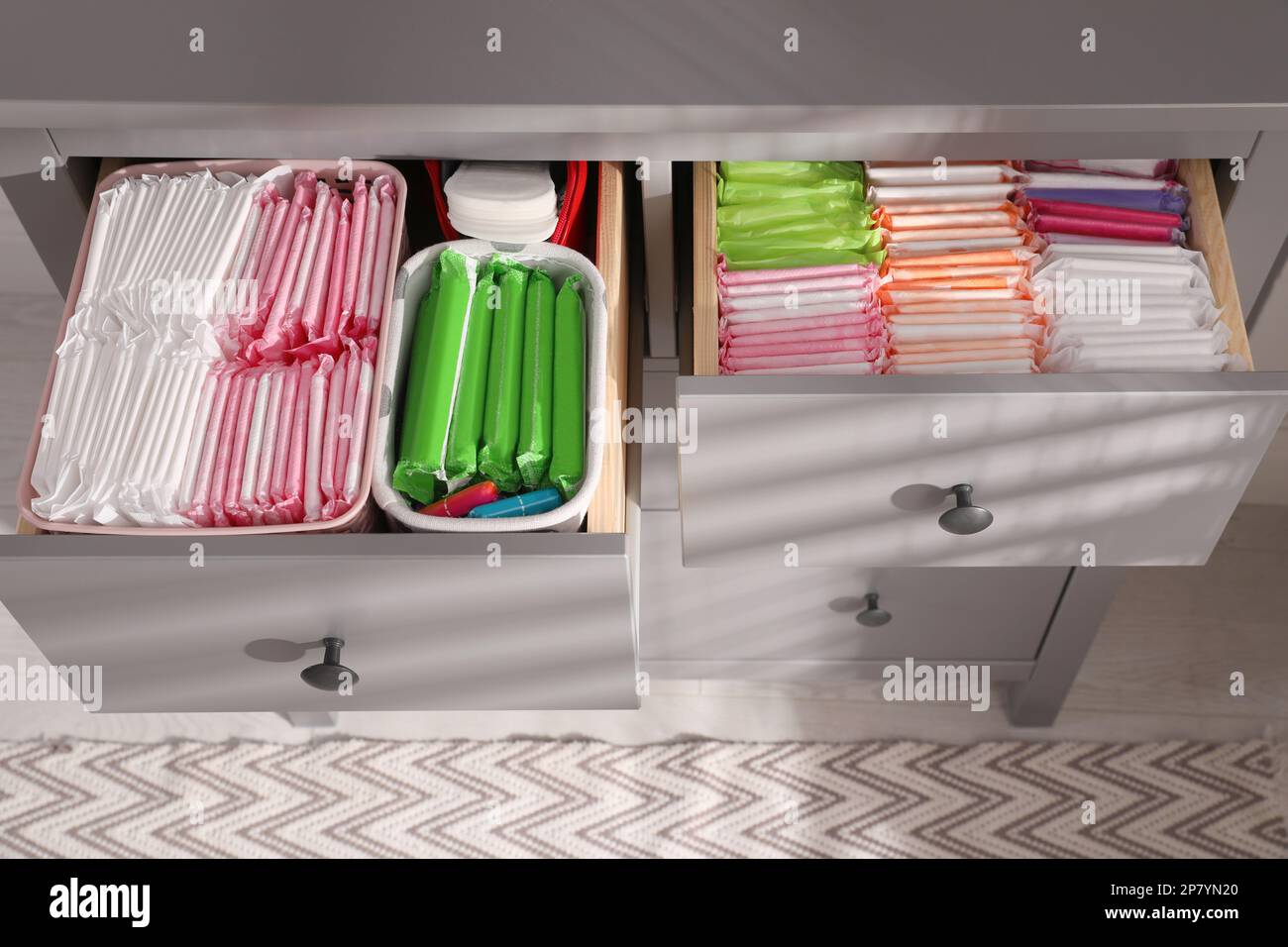 Open Cabinet Drawers With Menstrual Pads Tampons And Pantyliners 