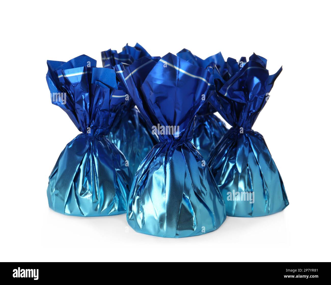 Delicious candies in blue wrappers on white background Stock Photo - Alamy