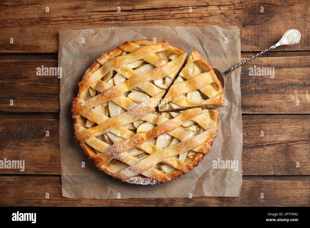 Delicious traditional apple pie on wooden table, top view Stock Photo