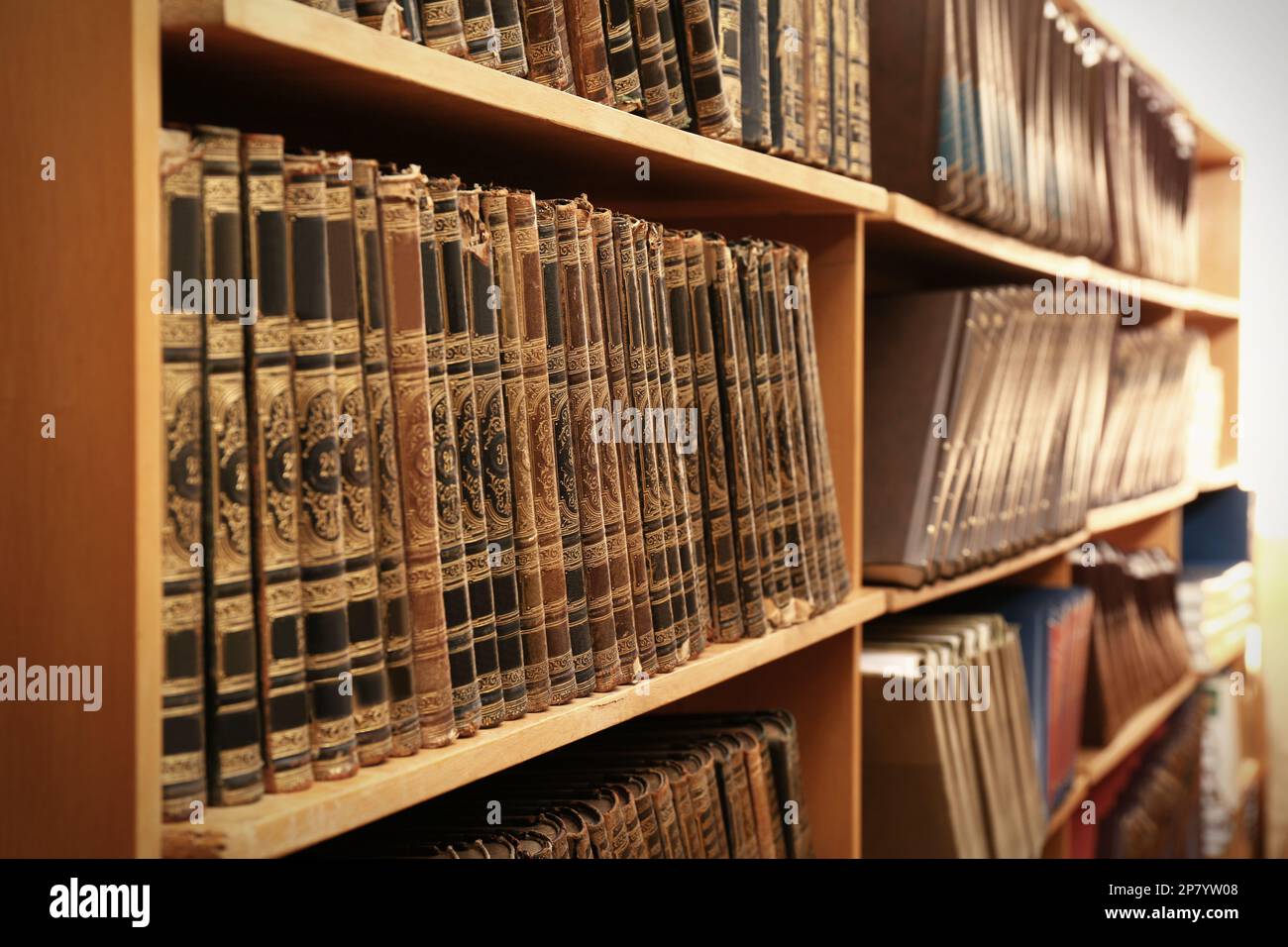 Collection of old books on shelves in library Stock Photo - Alamy