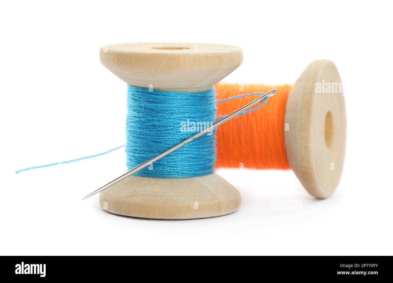 Colorful sewing threads with needle on white background Stock Photo - Alamy