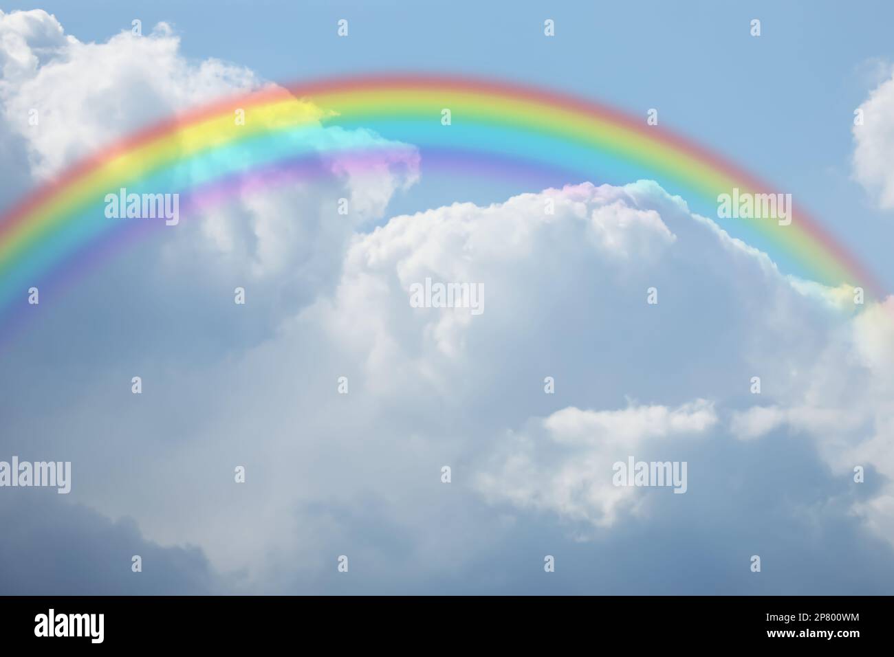 Beautiful rainbow in blue sky with white clouds on sunny day Stock ...