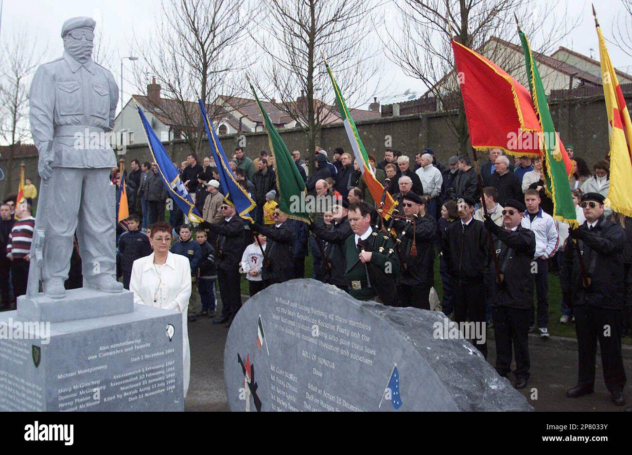 FILE - A Republican colour guard dressed in Paramilitary style uniforms ...