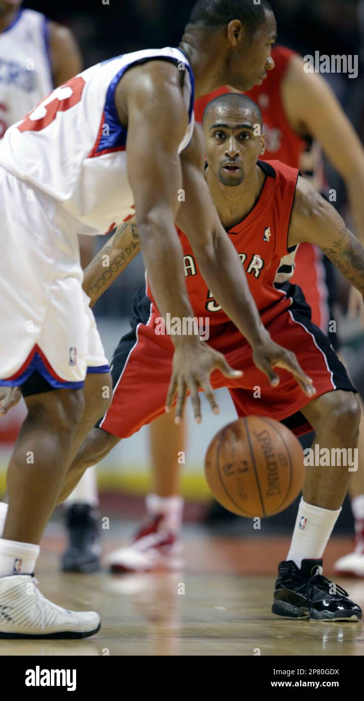 Toronto Raptors guard Quincy Douby dives to try to stop a loose ball from  going out of bounds in the second half of an NBA basketball game against  the Philadelphia 76ers in