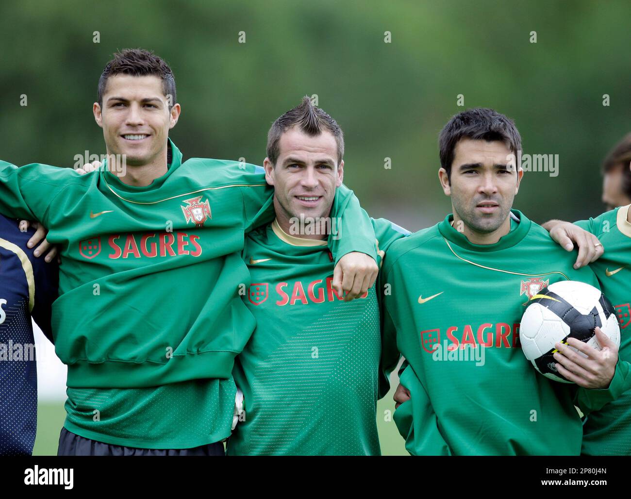 Players Cristiano Ronaldo, Duda and Deco, from left to right, pose for a  photgraph before a training session of Portugal's soccer team Tuesday, Oct.  6 2009, in Obidos, north of Lisbon. Portugal