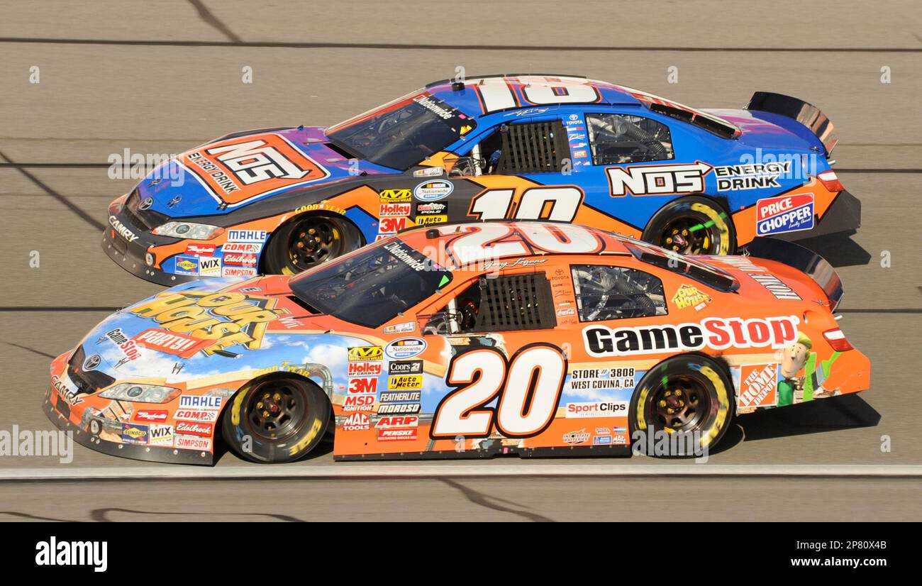 NASCAR Nationwide driver Joey Logano (20) passes Kyle Busch (18 