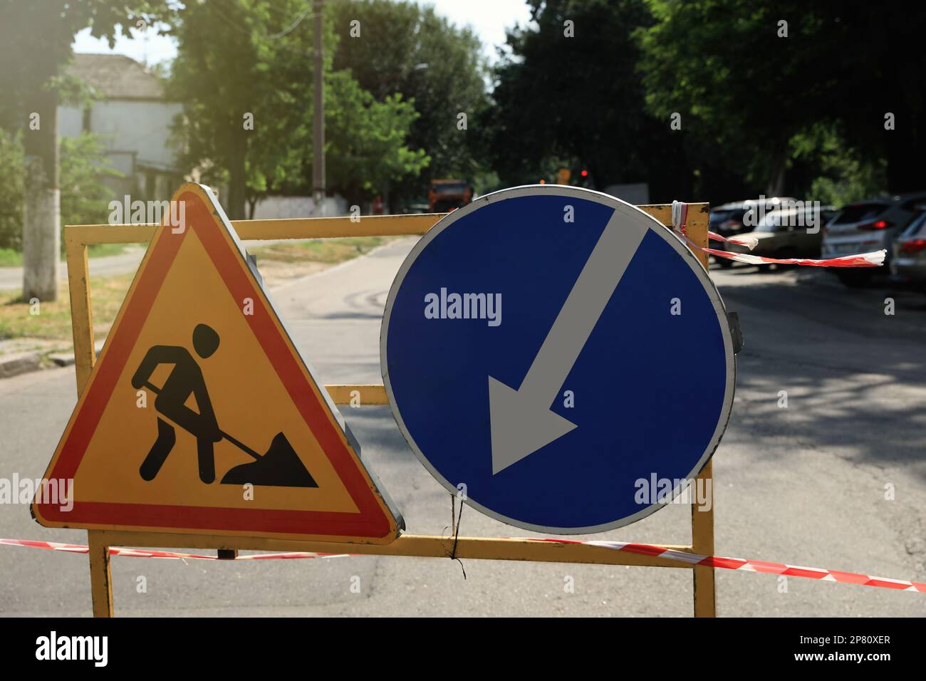 Barricade with traffic signs on city street. Road repair Stock Photo