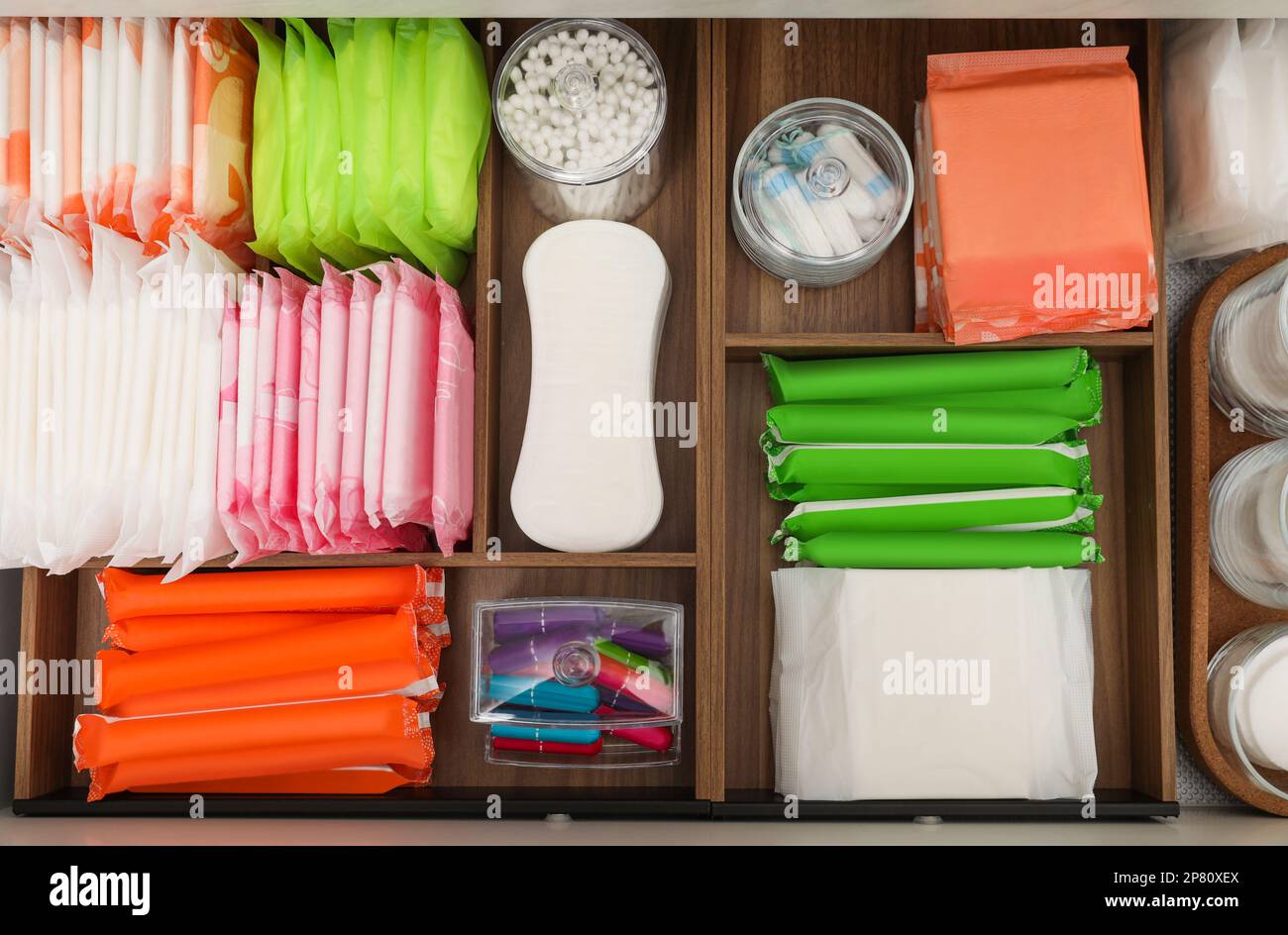 Storage of different feminine hygiene products in wooden organizers