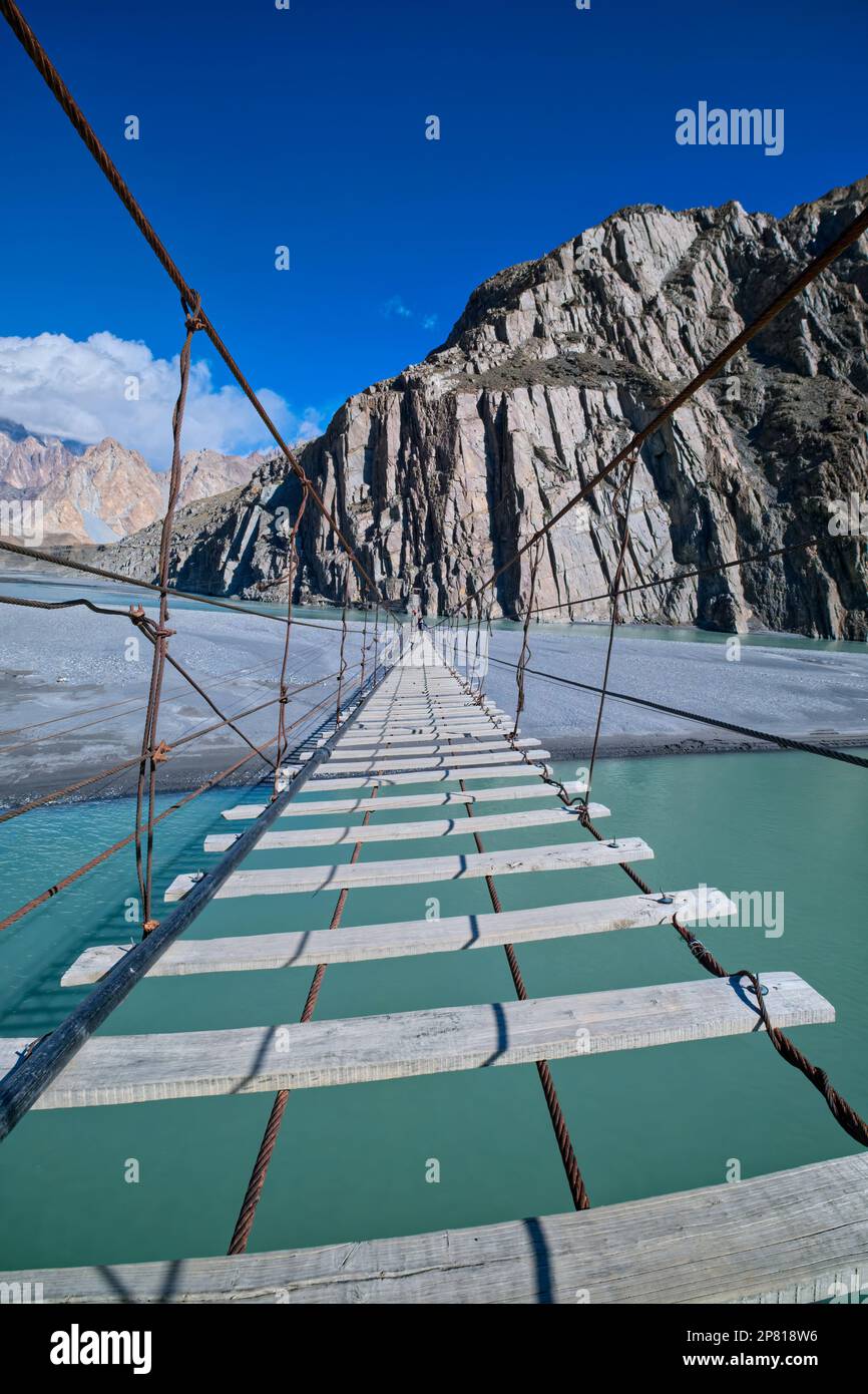 The bridge looks risky; however, the Hussaini is a secure bridge. It has become one of the most visited attractions, with hikers testing their nervous Stock Photo