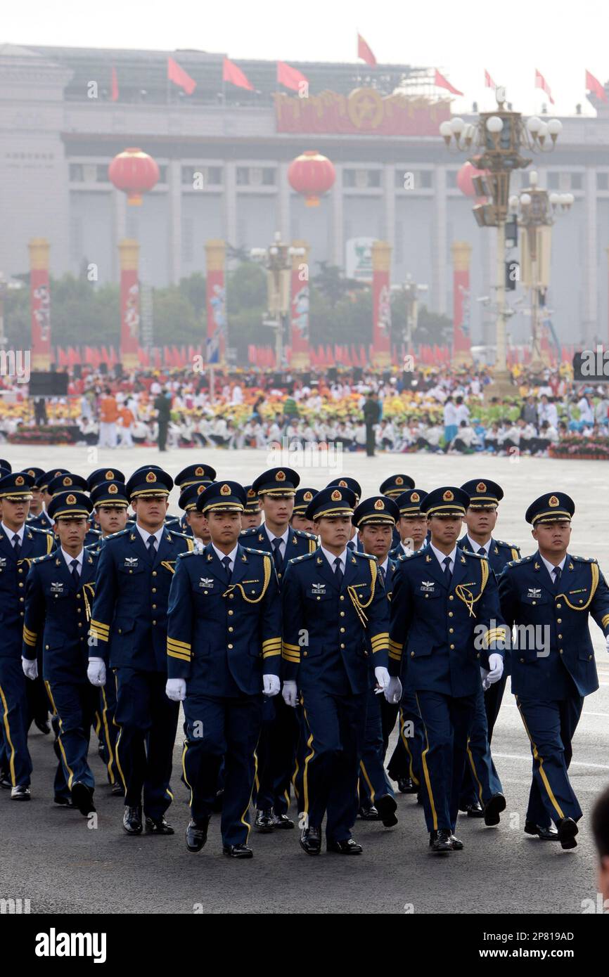 People's Liberation Army personnel walk past Tiananmen Square in their ...