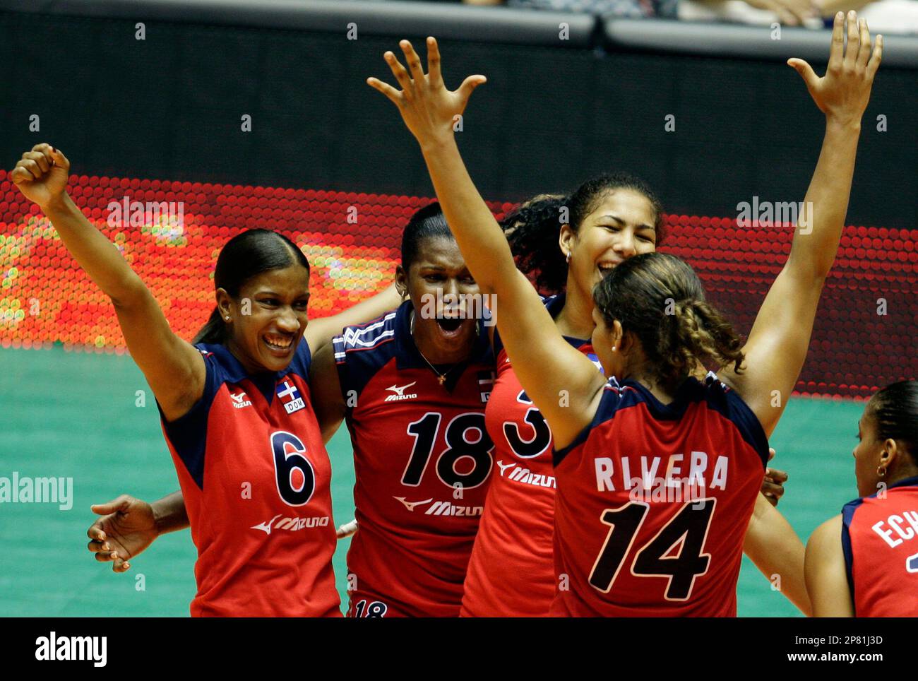 Dominican Republics volleyball players, from left, Ana Binet, Bethania de la Cruz, Lisvel Eve, Prisilla Rivera and Karla Echenique celebrate their victory over Puerto Rico and winning the gold medal at the