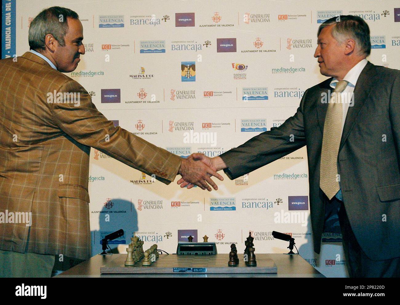Former chess world champions Garry Kasparov, right, and Anatoly Karpov,  left, play an exhibition rematch in Valencia, Spain, Tuesday, Sept. 22,  2009. Chess eminences Kasparov and Karpov are dusting off their knights