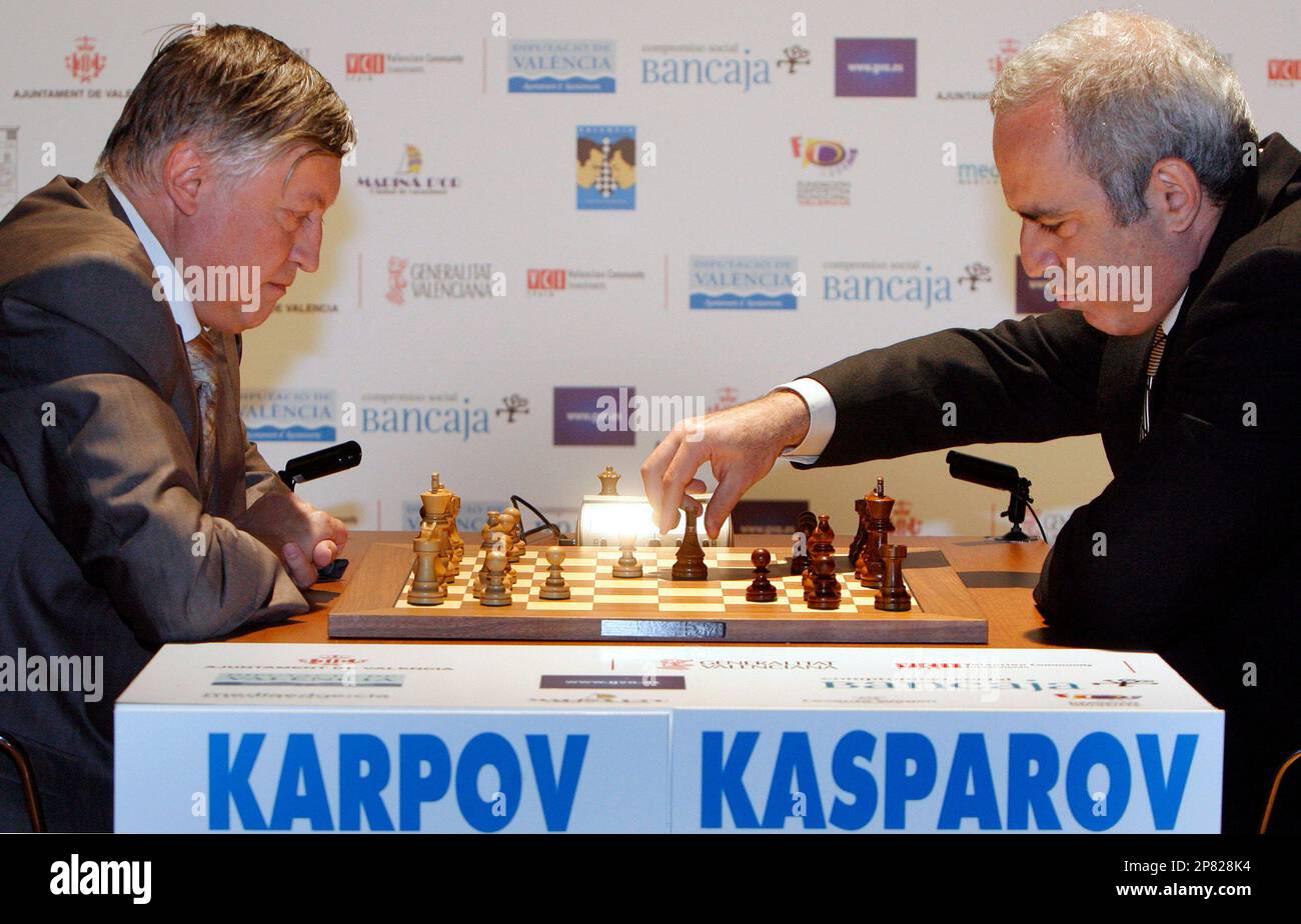 Former chess world champions Garry Kasparov, right, and Anatoly Karpov,  left, play an exhibition rematch in Valencia, Spain, Tuesday, Sept. 22,  2009. Chess eminences Kasparov and Karpov are dusting off their knights