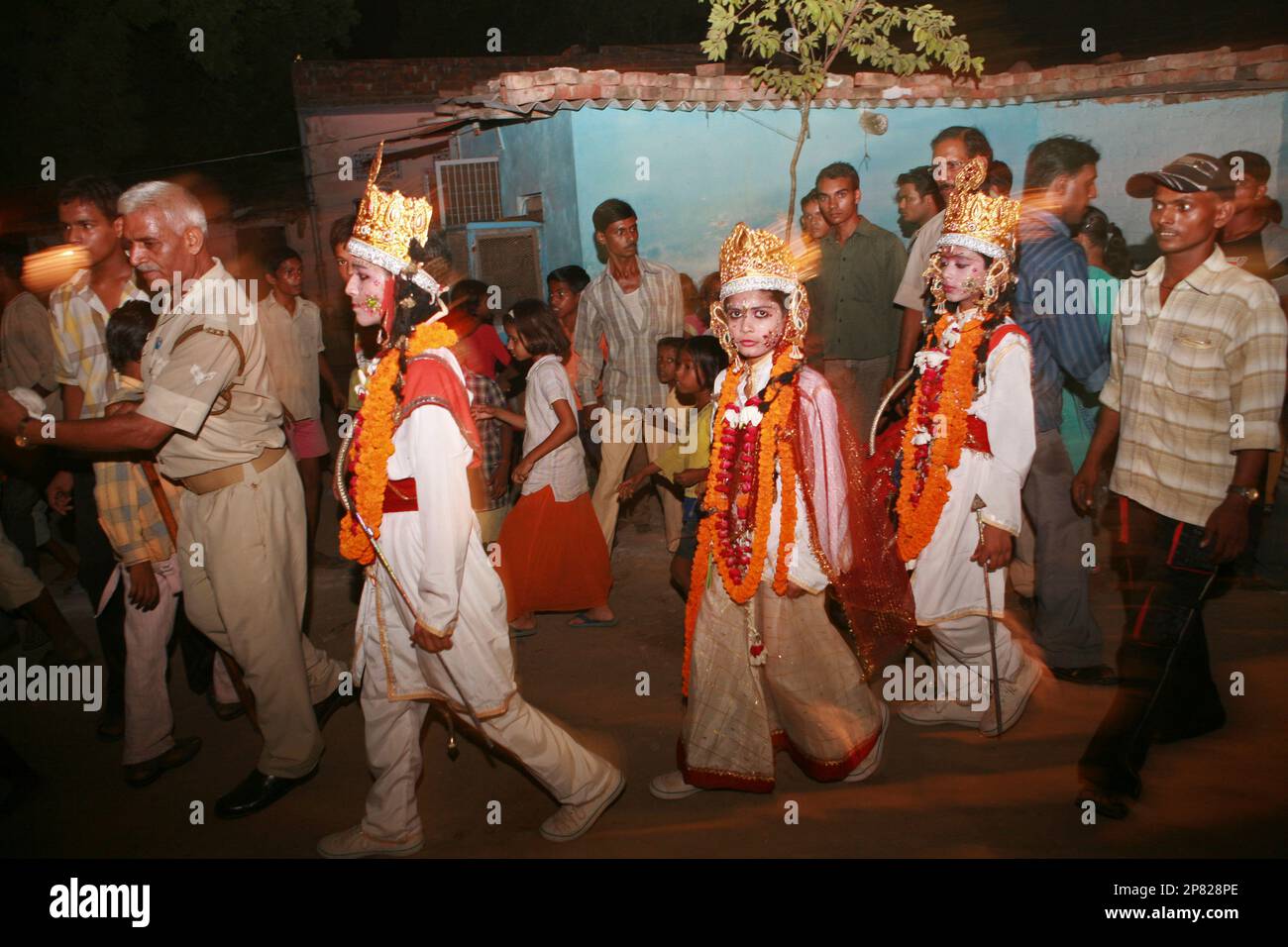 Children dressed as Hindu gods from left, Rama, Sita and Laxman ...
