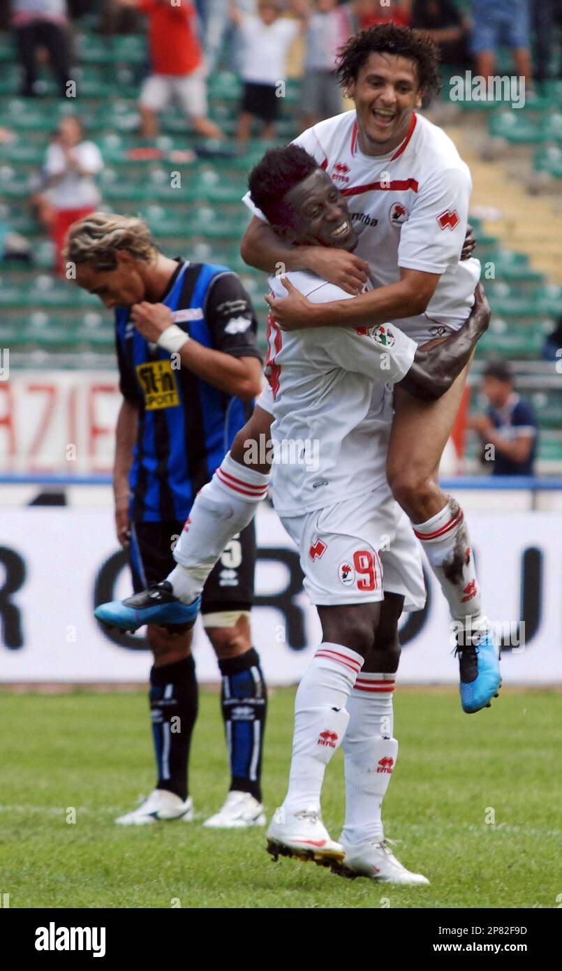 bari-s-edgar-alvarez-at-center-standing-no-9-reacts-with-teammate