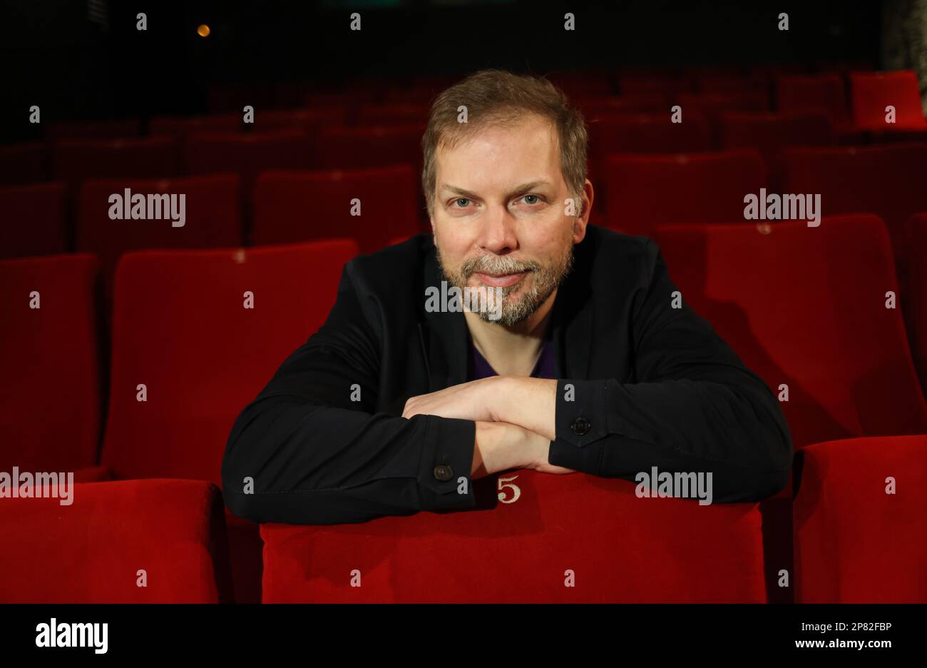 Hamburg, Germany. 08th Mar, 2023. Helge Albers, managing director of Moin Filmförderung Hamburg Schleswig-Holstein GmbH, sits during a photo session in a cinema auditorium at Zeise Kino. Last year, filmmakers in Hamburg and Schleswig-Holstein spent around 2,000 days shooting for new films and series. Credit: Christian Charisius/dpa/Alamy Live News Stock Photo