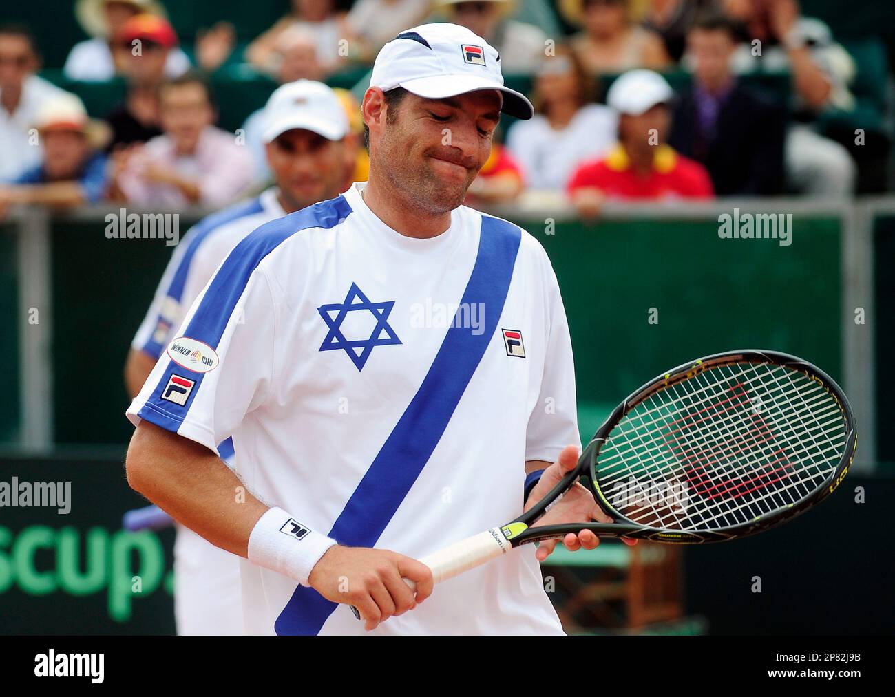 Israel's Jonathan Erlich, right, and his teammate Andy Ram, left, react  against Spain's Feliciano Lopez and Tommy Robredo during their semifinal  doubles Davis Cup match in Torre Sancho, Spain, Saturday Sept. 19,