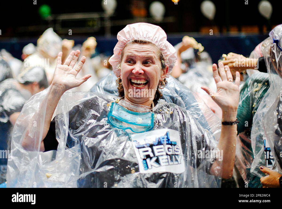 A woman participates in the World’s Largest Pie Fight in front of ABC