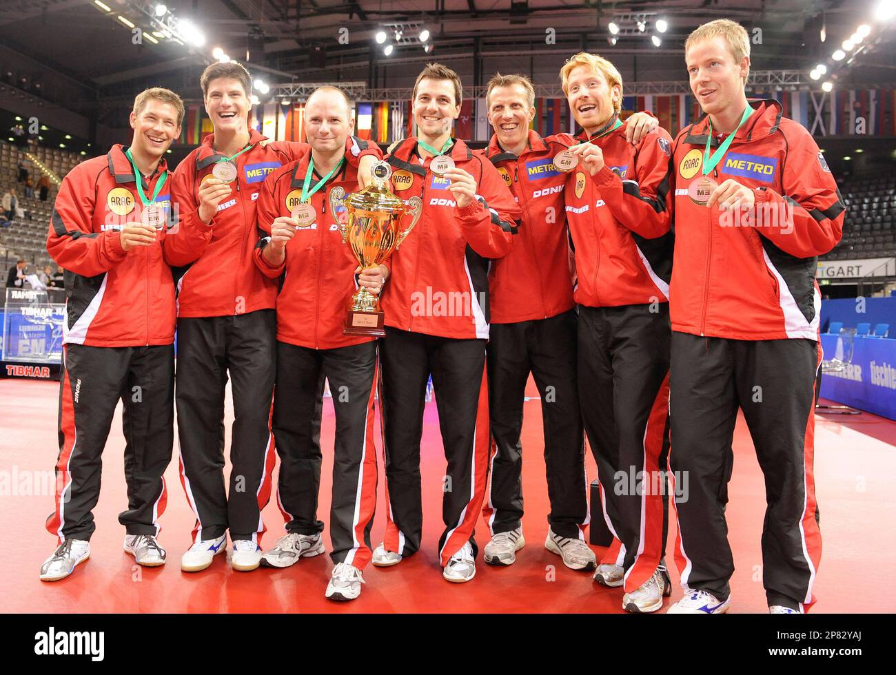 Germany's table tennis national team presents the trophy and medals