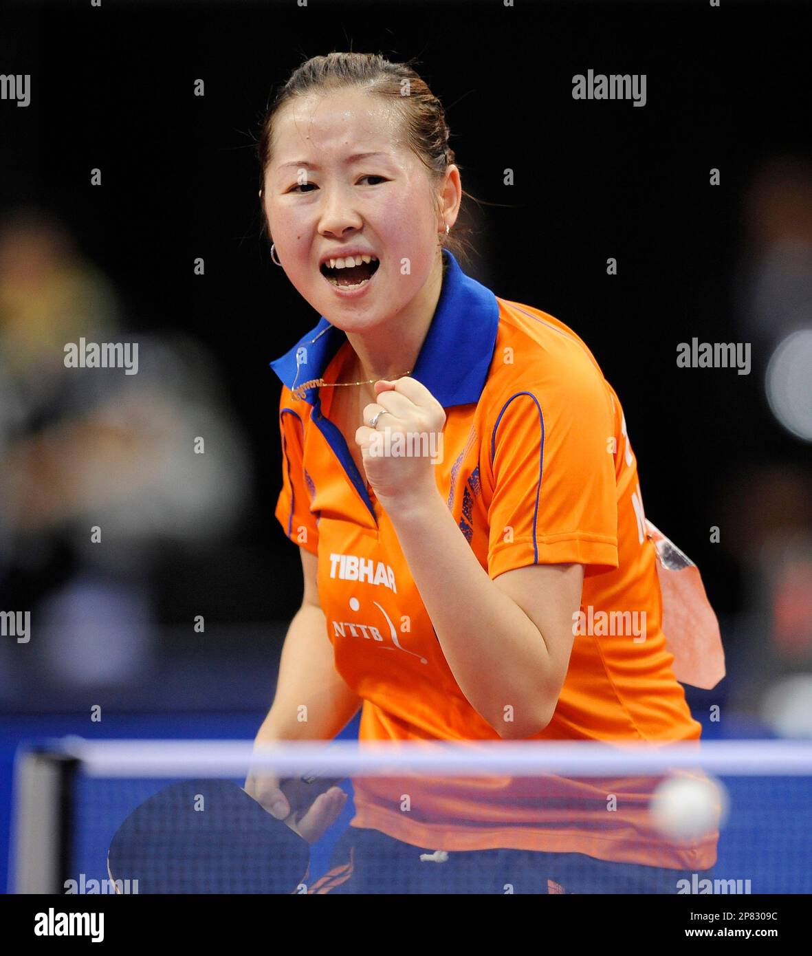 Table tennis player Li Jie from The Netherlands reacts on winning a point  in her Women's team final match against Poland's Natalia Partyka during the  team competition of the Table Tennis European