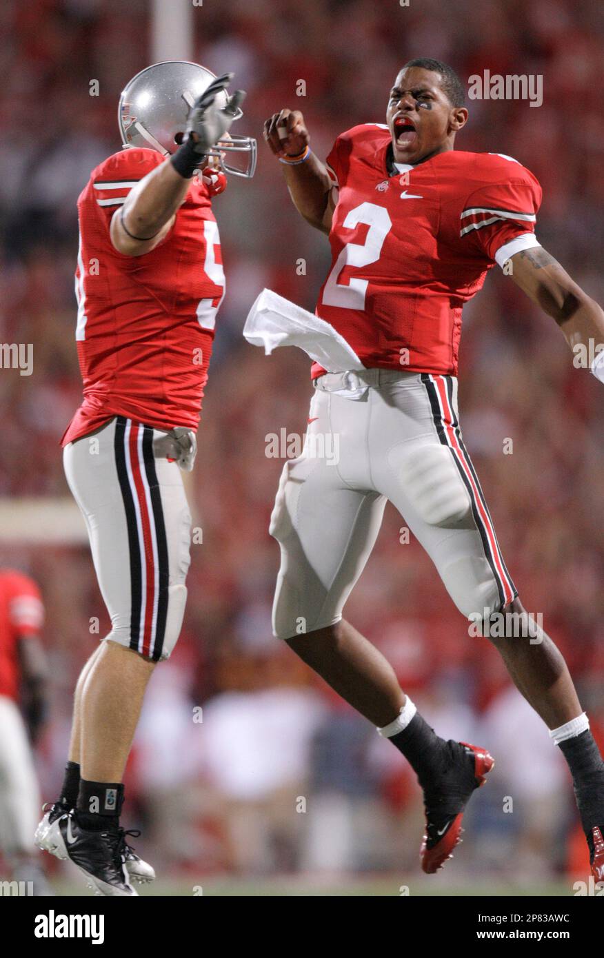 Ohio State quarterback Terrelle Pryor (2) celebrates with Ross Homan