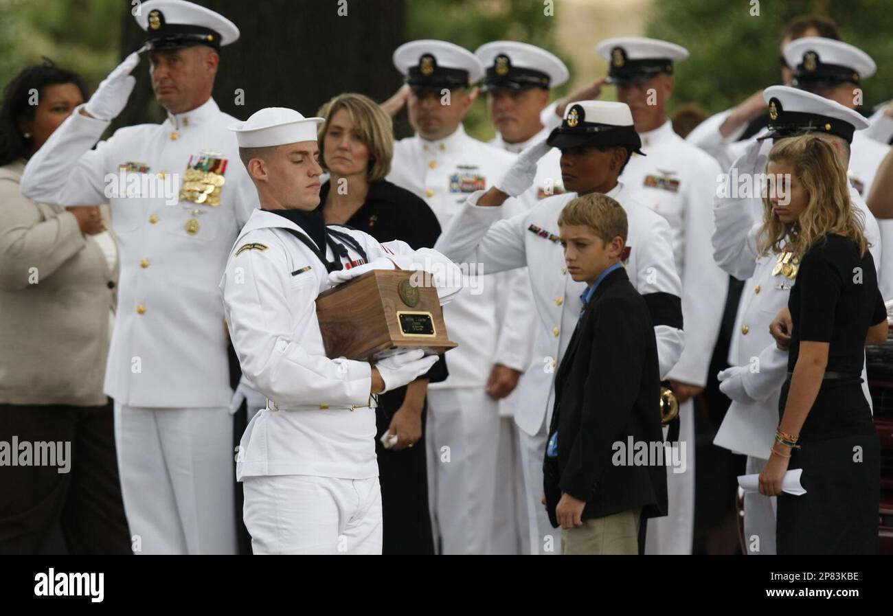 A Navy honor guard carries the remains of U.S. Navy Command Master