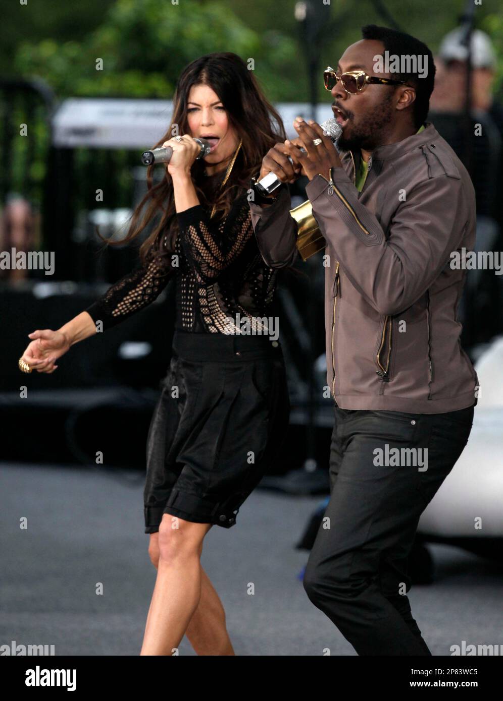 The Black Eyed Peas' Fergie, left, and will.i.am perform Tuesday, Sept. 8, 2009 in Chicago while