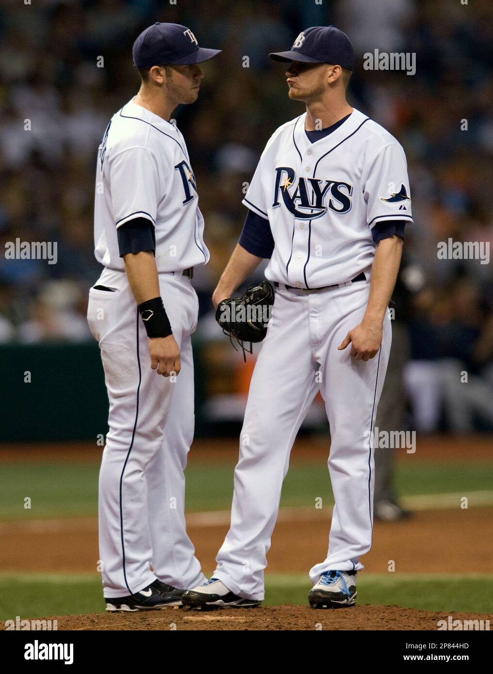 Tampa Bay Rays' Evan Longoria, left, talks with reliever J.P. Howell on ...