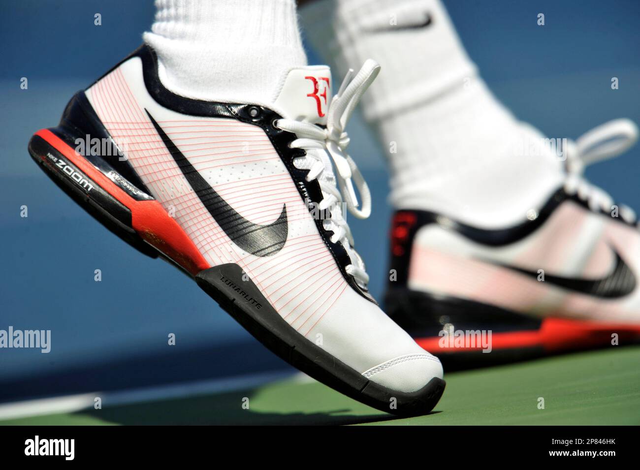 The signature shoes of top-seeded Roger Federer of Switzerland, are shown  as he serves to Lleyton Hewitt of Australia, during the third round of the  U.S. Open tennis tournament in New York,