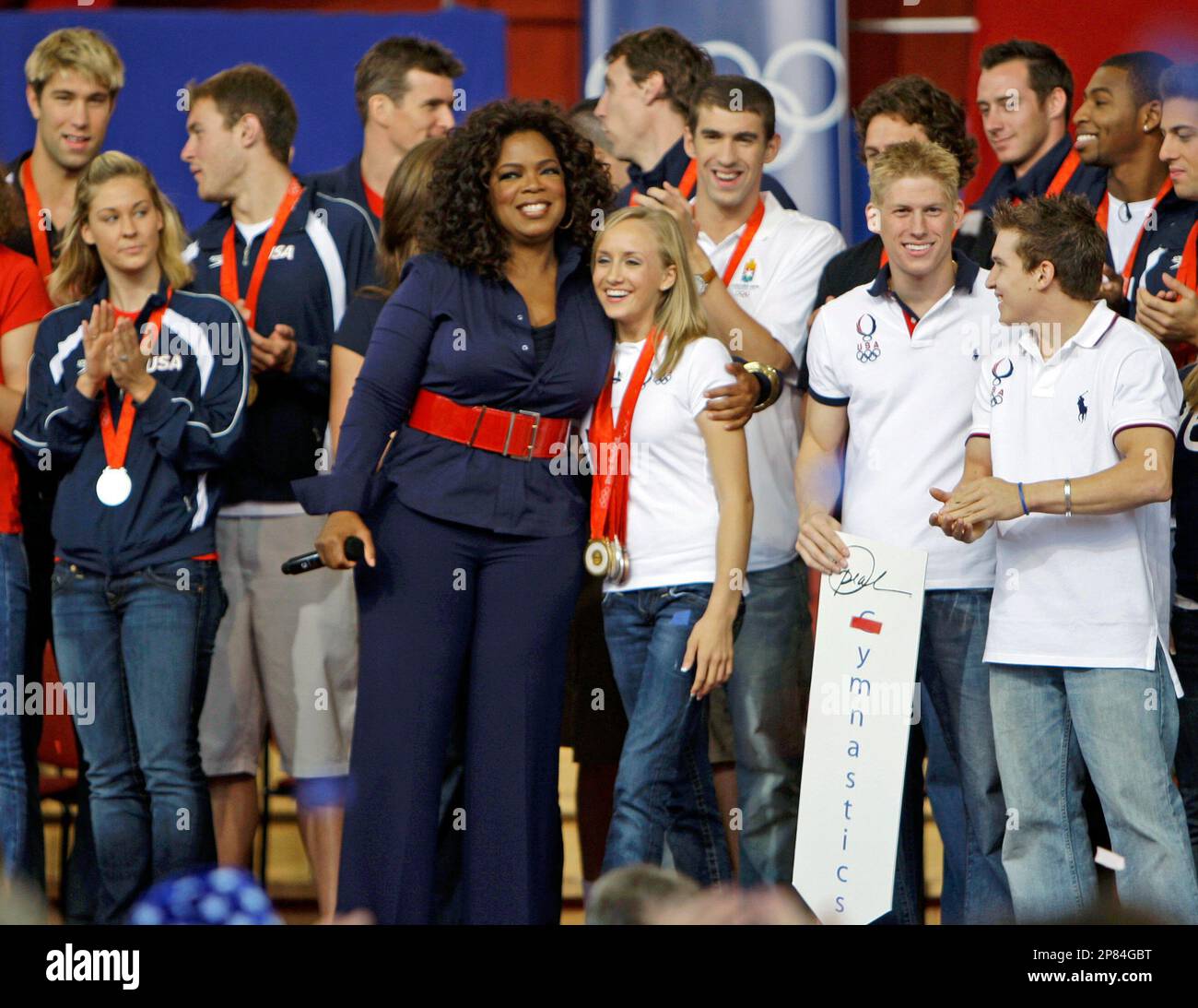 FILE In this Sept. 8, 2008, file photo Oprah Winfrey, center, hugs