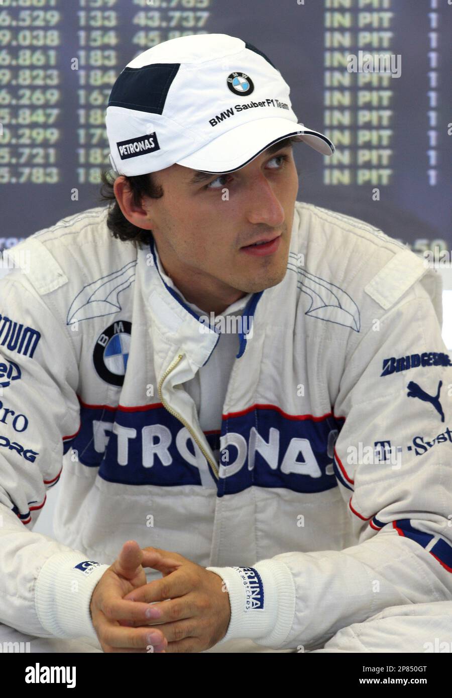 BMW Sauber driver Robert Kubica of Poland waits at the pitbox moments