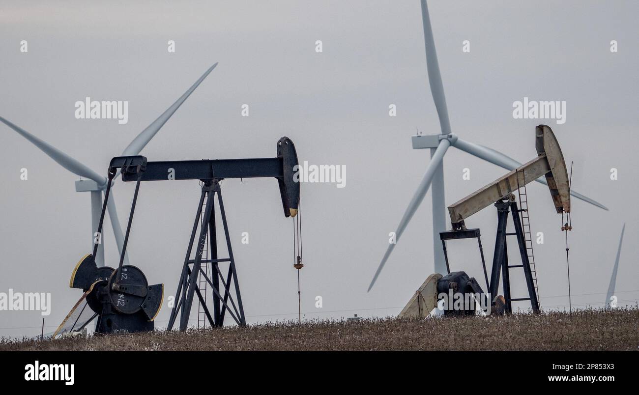 Dallas, United States. 08th Mar, 2023. Oil derricks and wind mills are juxtaposed northwest of Dallas in western Texas on Wednesday, March 8, 2023. Texas was built on oil but now the state is a national leader in wind and solar energy. Photo by Pat Benic/ Credit: UPI/Alamy Live News Stock Photo