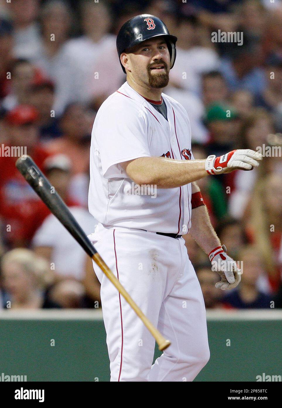 Boston Red Sox's Kevin Youkilis tosses his bat after striking out looking  with one man on against Chicago White Sox starter Jose Contreras during the  first inning of a baseball game at