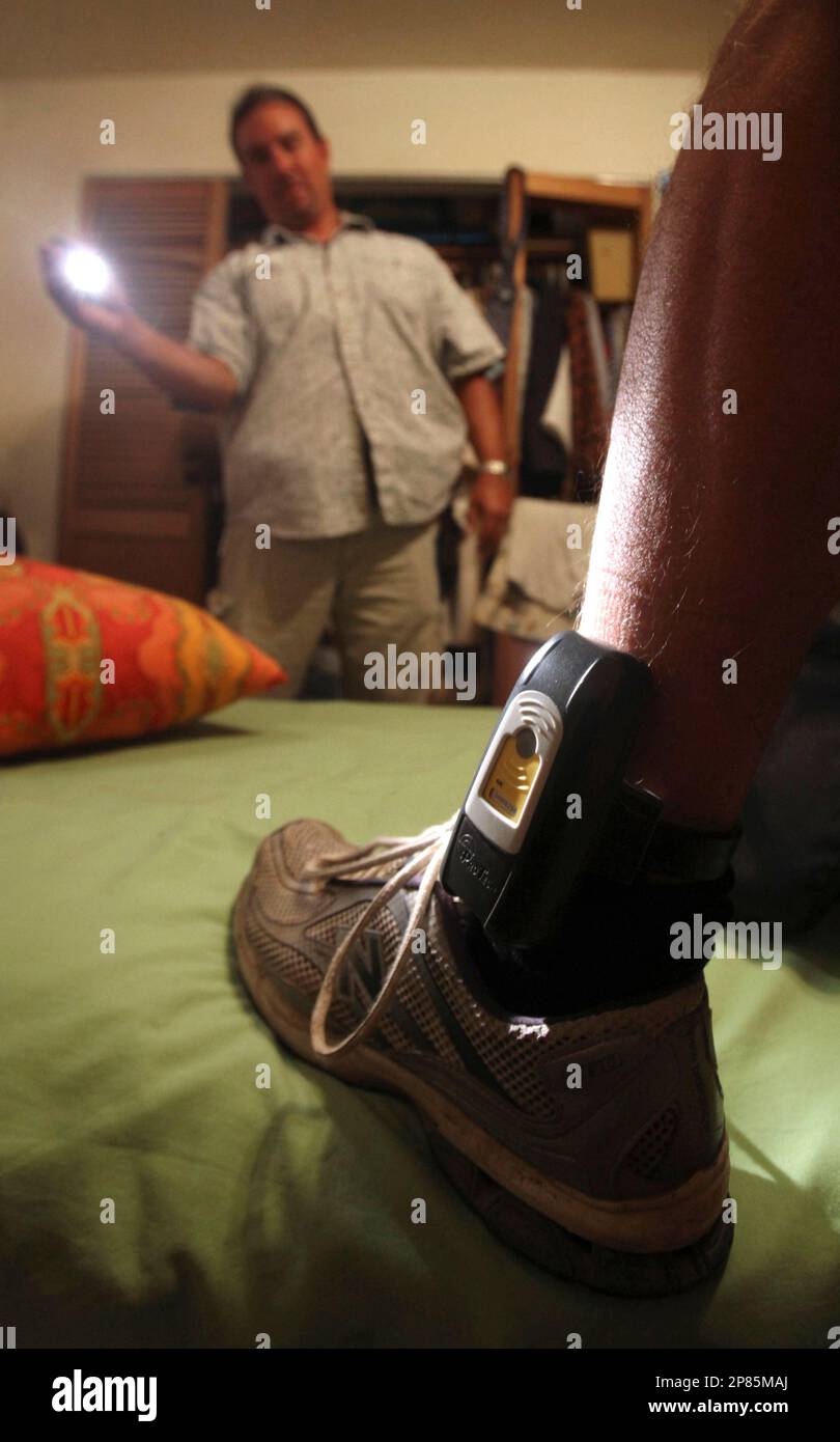 In this photo taken Monday, Aug. 3, 2009, Parole Agent Steve Nakamura