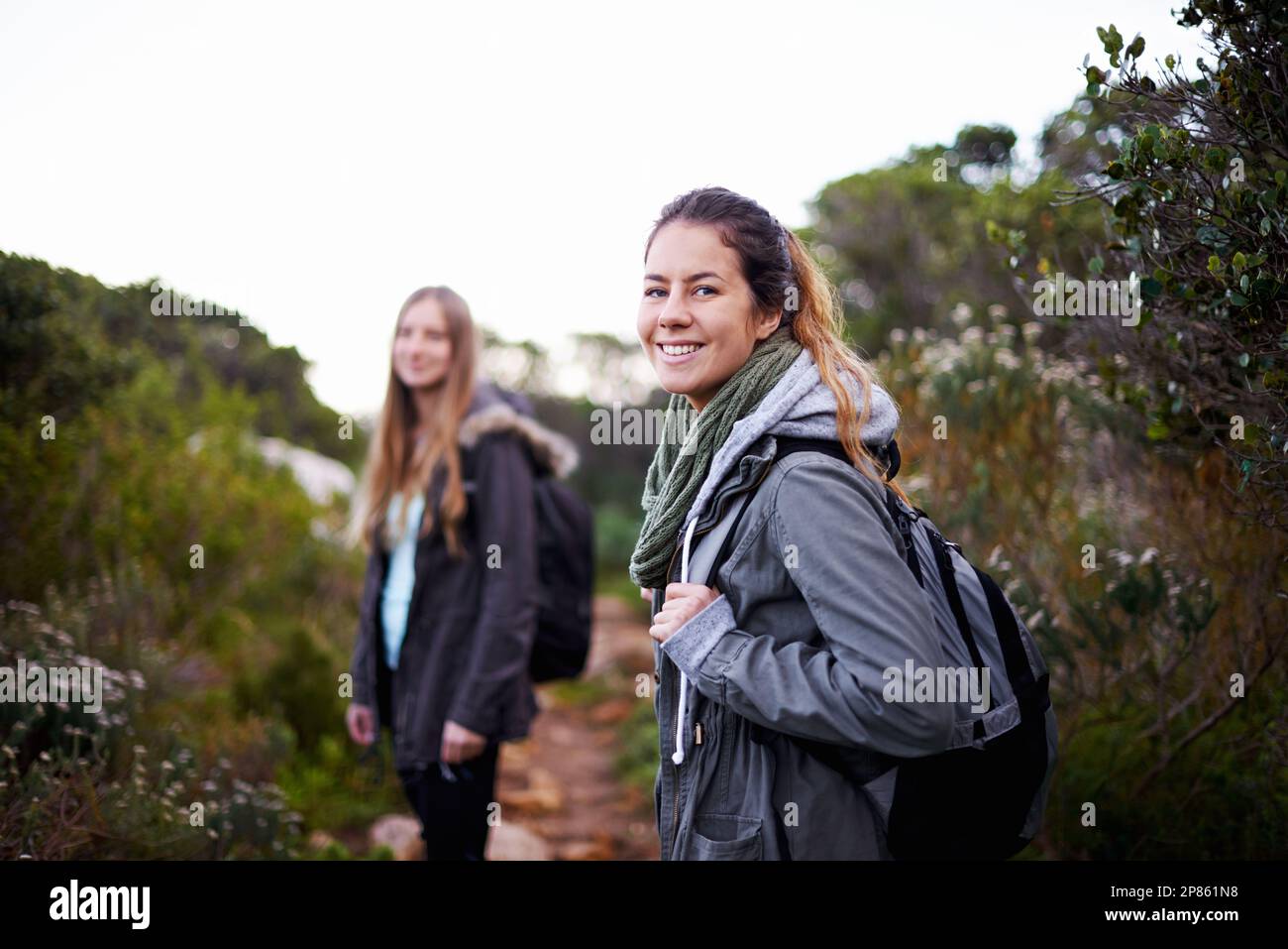 Time for an adventure. two attractive young female hikers in the ...