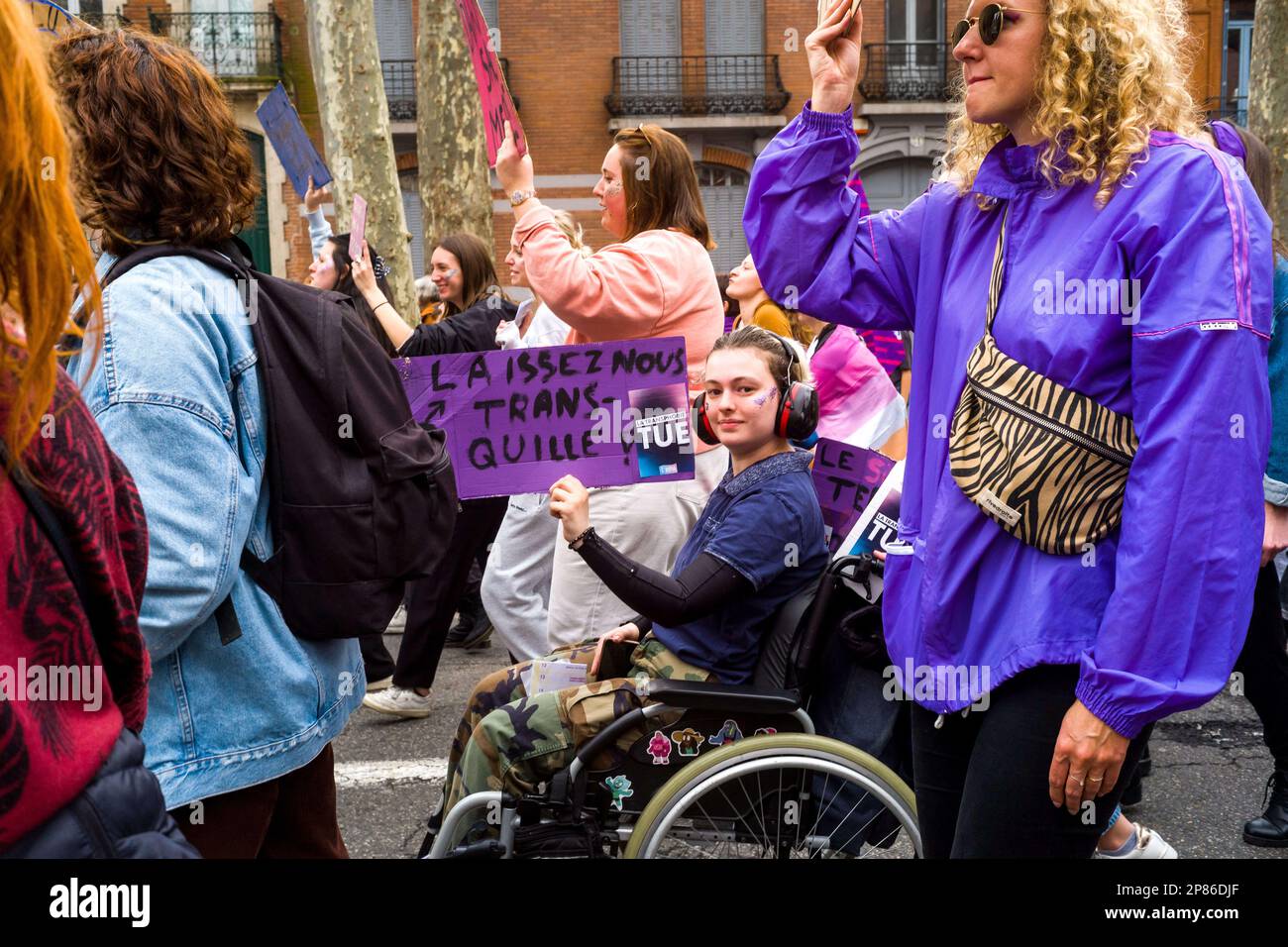 Toulouse, France. 08th Mar, 2022. A young woman in the procession in a