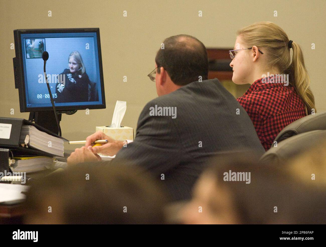 Amanda Leppert, right, sits next to her attorney Christopher