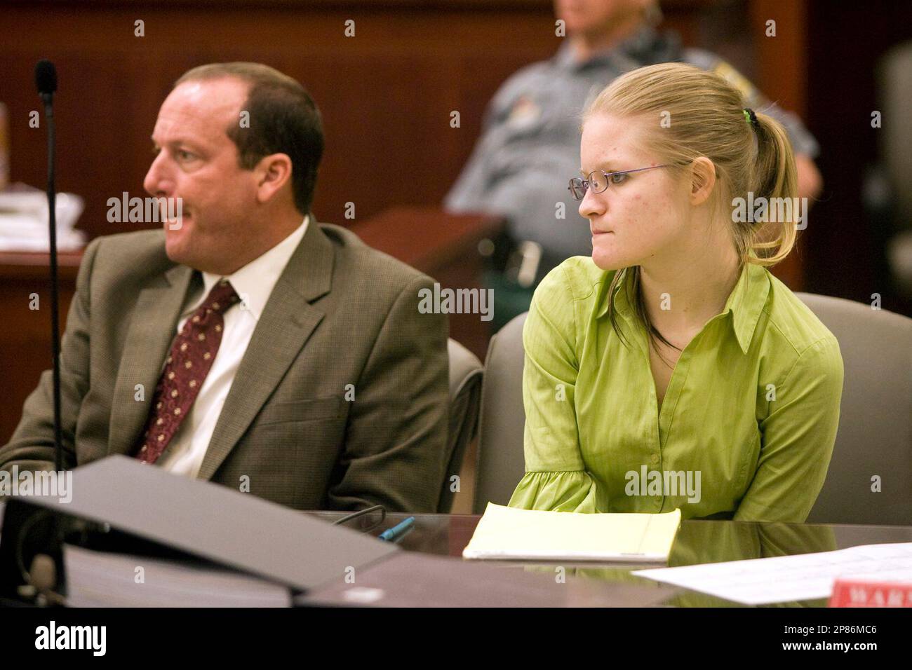 Amanda Leppert, right, sits with her attorney Christopher Smith