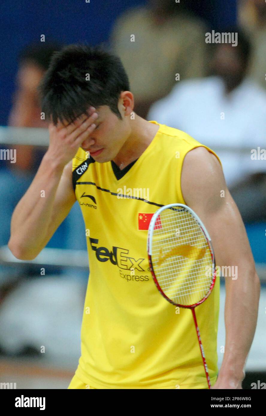 China's badminton player Lin Dan reacts during a practice session in