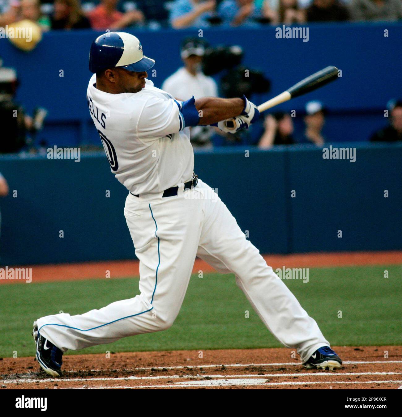 Toronto Blue Jays' Vernon Wells hits a home run against Baltimore Orioles  pitcher Jason Berken during second-inning baseball game action at Rogers  Centre in Toronto on Friday, Aug. 7, 2009. (The Canadian