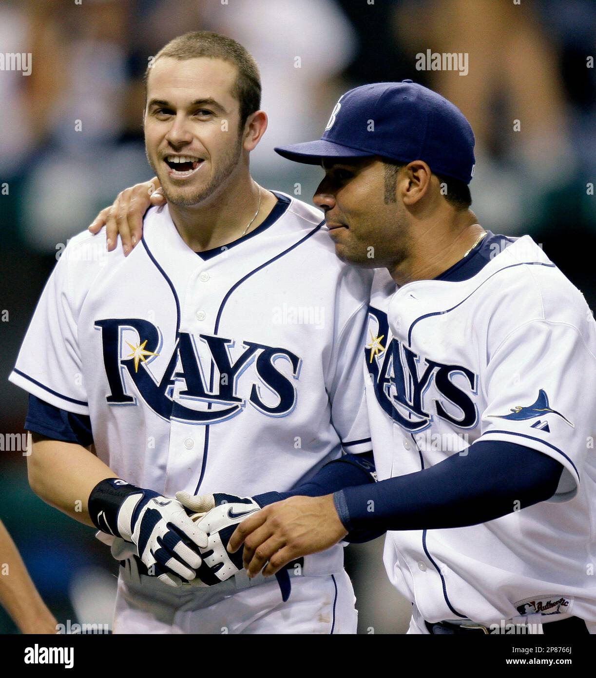 Tampa Bay Rays' Evan Longoria, left, celebrates with teammate Carlos Pena  after Longoria hit a two-run, game-winning home run off Boston Red Sox  pitcher Takashi Saito in the 13th inning of a