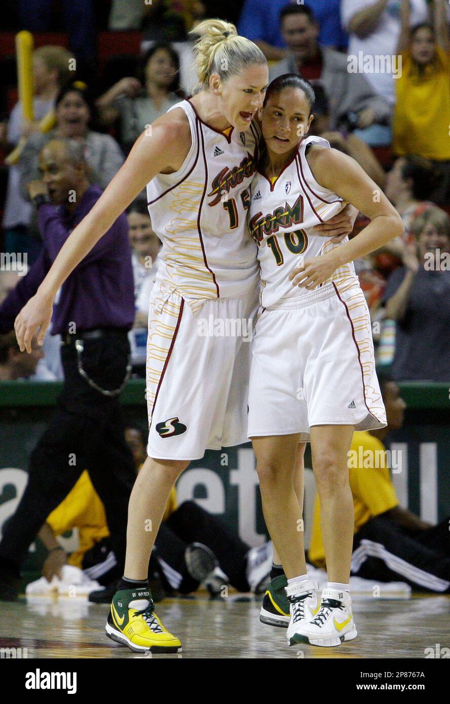 Seattle Storm's Lauren Jackson, left, grabs Sue Bird after