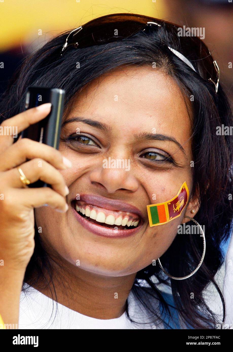 A Sri Lankan member of the audience takes a video of her friends and herself on her mobile phone as she cheered, on the second one-day international cricket match between Sri Lanka