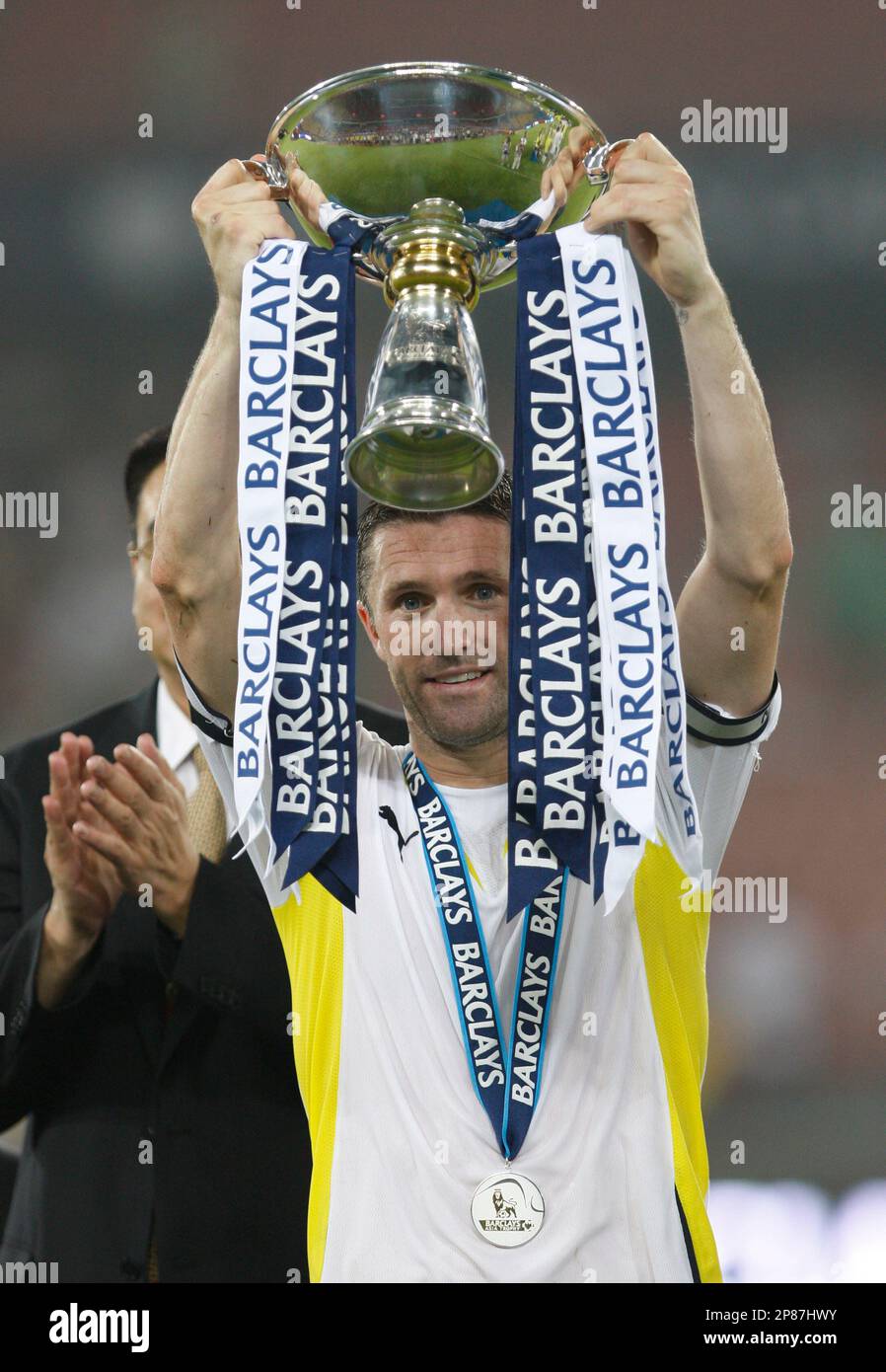 Tottenham Hotspur`s Robbie Keane with the trophy Barclays Asia