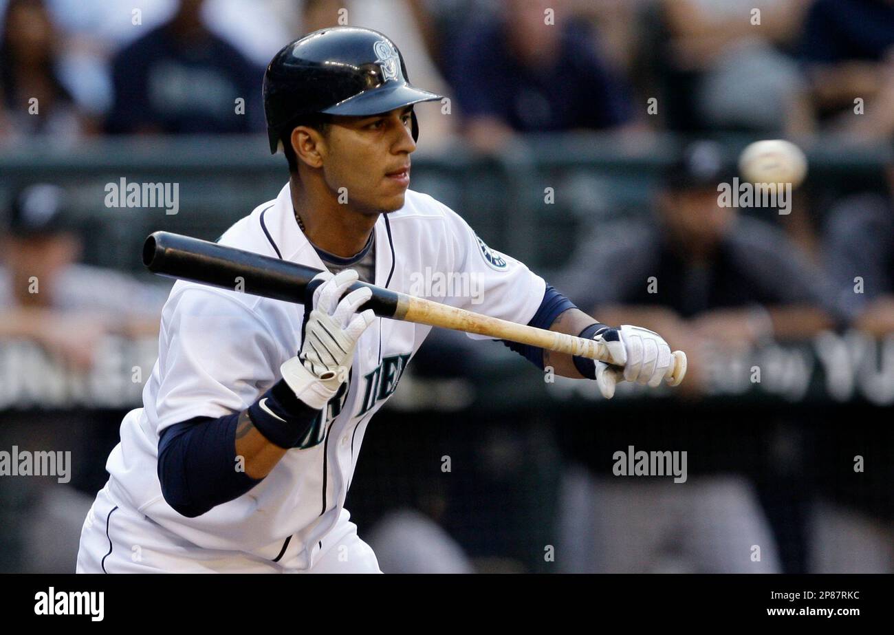 Seattle Mariners' Ronny Cedeno lets a ball go by after turning to bunt  against the Toronto Blue Jays Wednesday, July 28, 2009, during a baseball  game in Seattle. Cedeno was traded to