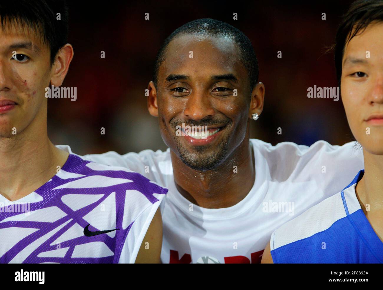 NBA superstar Kobe Bryant of the Los Angeles Lakers poses with fans
