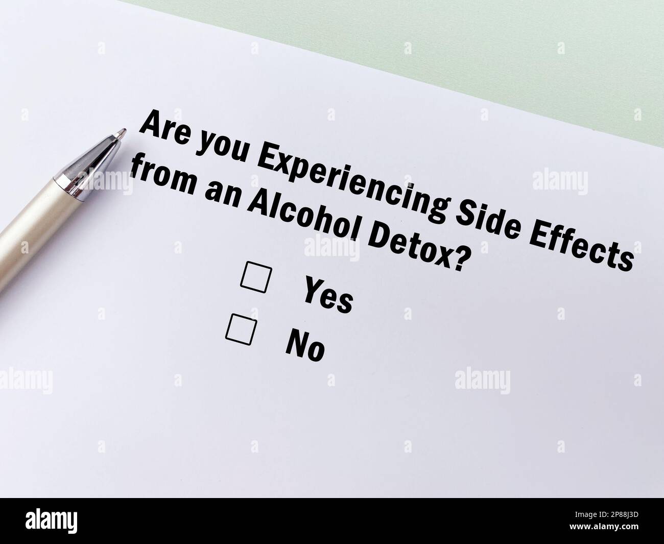 One person is answering question about side effects. She is experiencing side effects of alcohol detox. Stock Photo