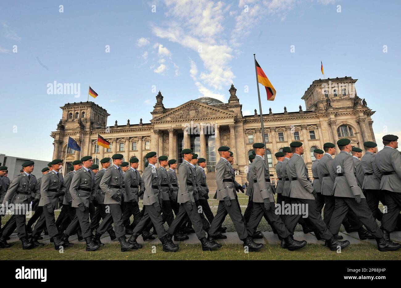 Soldiers of German Bundeswehr march in front of the Reichstag, which ...